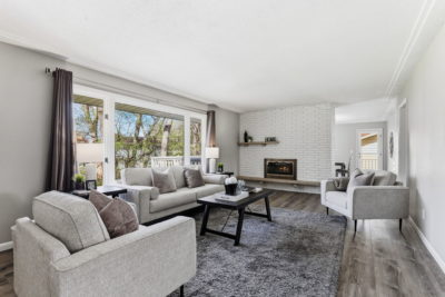 Spectacular move-in ready, mid-century rambler sitting pretty on a quiet, winding street, lined with gorgeous mature trees.