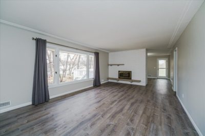 Spectacular move-in ready, mid-century rambler sitting pretty on a quiet, winding street, lined with gorgeous mature trees.
