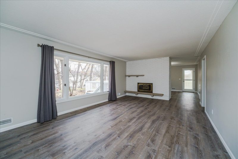 Spectacular move-in ready, mid-century rambler sitting pretty on a quiet, winding street, lined with gorgeous mature trees.