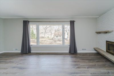 Spectacular move-in ready, mid-century rambler sitting pretty on a quiet, winding street, lined with gorgeous mature trees.