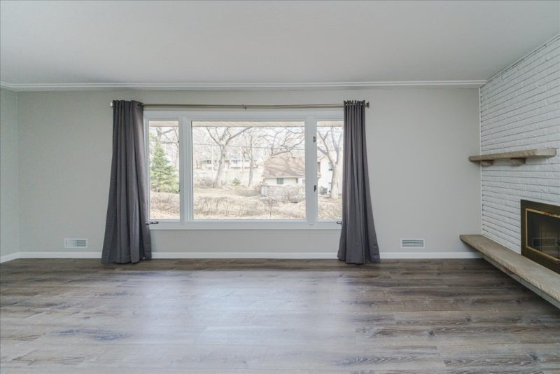 Spectacular move-in ready, mid-century rambler sitting pretty on a quiet, winding street, lined with gorgeous mature trees.