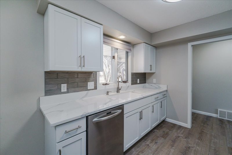 Spectacular move-in ready, mid-century rambler sitting pretty on a quiet, winding street, lined with gorgeous mature trees.