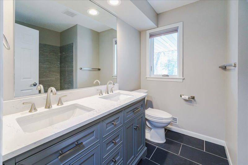 Spectacular move-in ready, mid-century rambler sitting pretty on a quiet, winding street, lined with gorgeous mature trees.